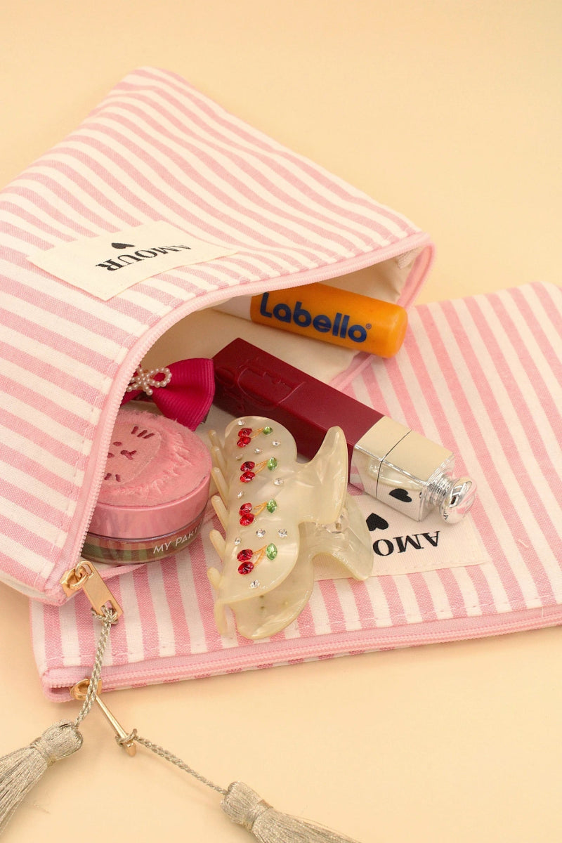 Pochette rayée rose avec pompons et message AMOUR - RIVE GAUCHE